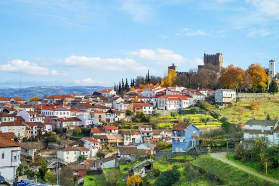 Braganca's hilltop castle above red-roofed houses and green Portuguese countryside