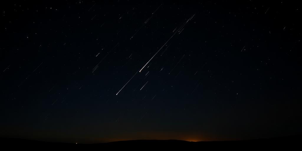 Perseid meteors streaking across a dark starry sky